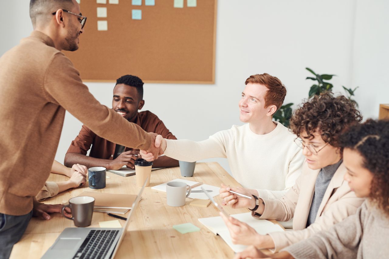 Crafting Captivating Headlines: Your awesome post title goes here A diverse team in a modern office working together on a project, showcasing teamwork and collaboration.